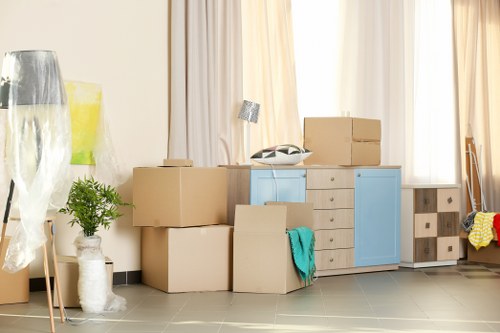 Maidavale Removals team sorting reusable items for recycling and donation