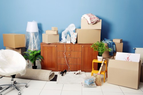Office relocation planning in Maidavale with movers preparing desks and boxes