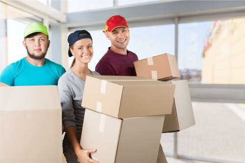 Packed moving boxes and furniture ready for house removals in Maidavale