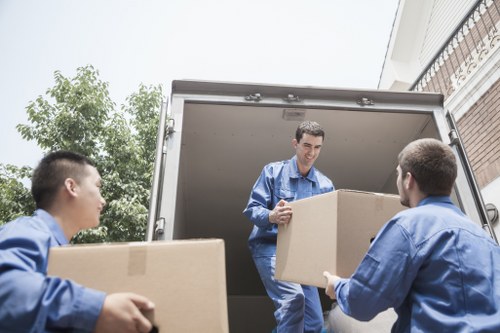 Moving team navigating a residential street in Maidavale