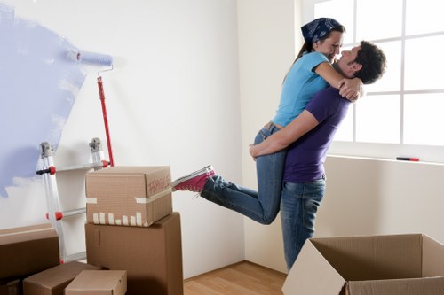 Professionals handling desks and office items during a commercial relocation
