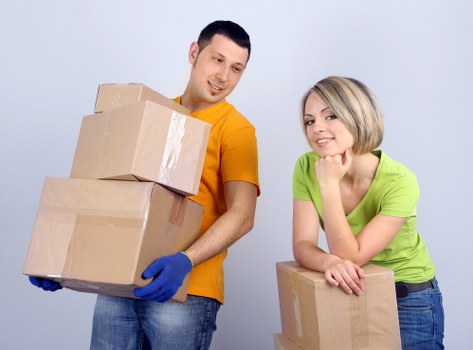 Packed moving boxes and household items prepared for transport