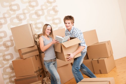 Careful packing of fragile belongings during a Maidavale house move