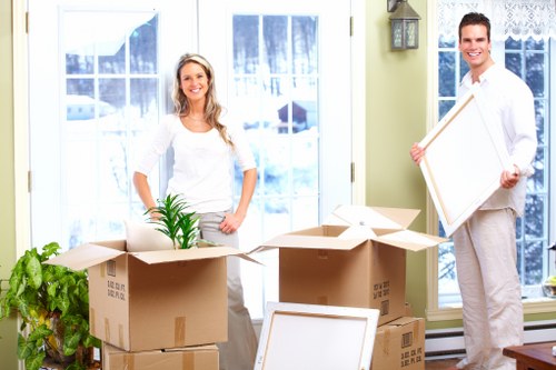 Professional movers handling flat removal items in Maidavale