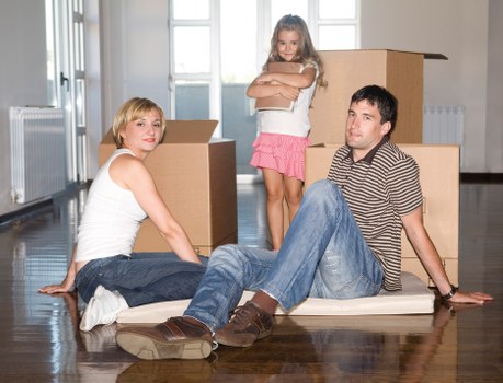 Movers loading furniture into a removal truck